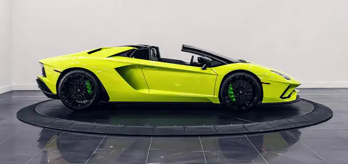 green-lamborghini-aventador-s-roadster-rental-side-view-orlando-exotic-car-rentals