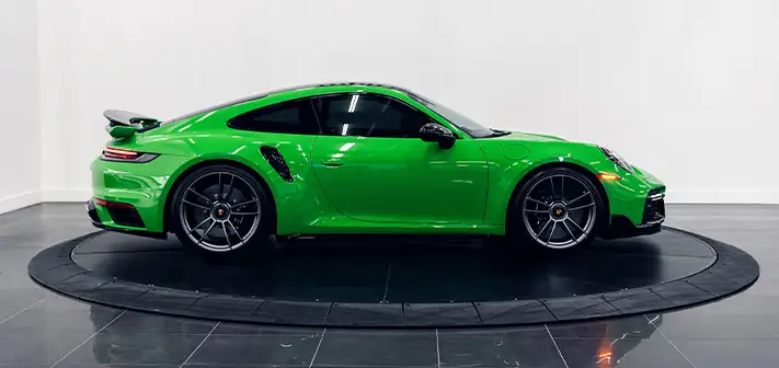 green-porsche-911-turbo-s-rental-side-view-orlando-exotic-car-rentals