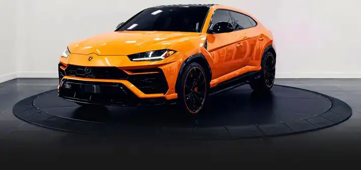 orange-lamborghini-urus-rental-profile-view-orlando-exotic-car-rentals