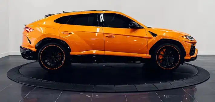 orange-lamborghini-urus-rental-side-view-orlando-exotic-car-rentals