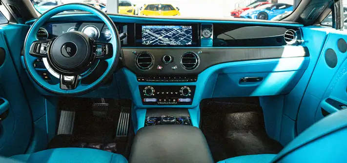 Grey on blue Rolls Royce Spectre rental dashboard view - Orlando exotic car rental