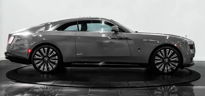Grey on blue Rolls Royce Spectre rental side view - Orlando exotic car rental