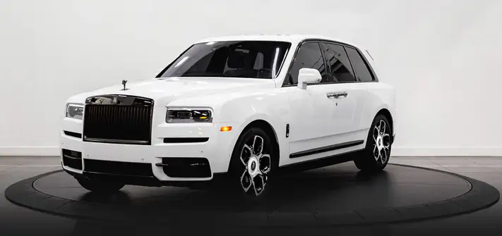 White on blue Rolls Royce Cullinan Black Badge rental profile view - Orlando exotic car rental