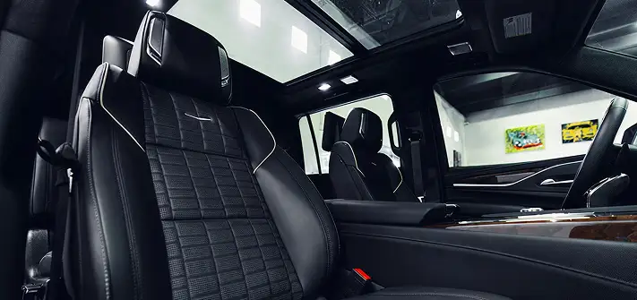Black on black Cadillac Escalade rental interior view - Orlando exotic car rentals