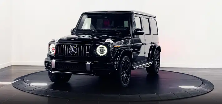 Black with red Mercedes Benz G63 AMG G-Wagon rental profile view - Orlando exotic car rental