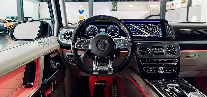 Sand on white interior Mercedes Benz G63 AMG G-Wagon rental interior view Orlando exotic car rental
