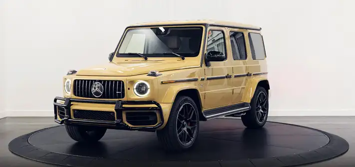 Sand on white interior Mercedes Benz G63 AMG G-Wagon rental profile view Orlando exotic car rental