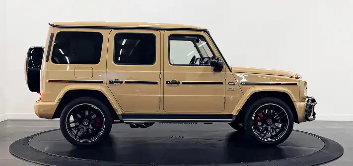 Sand on white interior Mercedes Benz G63 AMG G-Wagon rental side view Orlando exotic car rental